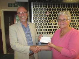 Peter Wigglesworth presenting Community Grant t Denise Peck of Starkholmes Village Hall